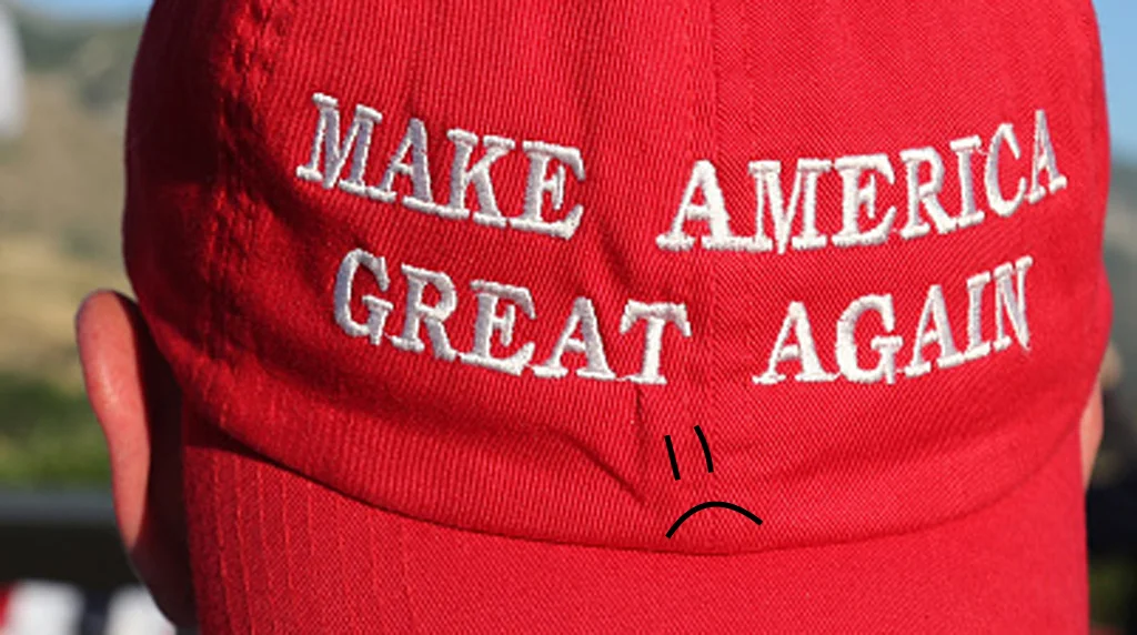 The Magaphobia meme image, featuring a MAGA hat marked with a sad face to represent fear or distress associated with the slogan.