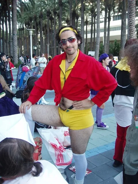 Man-Faye performs an enthusiastic dance for convention attendees, embracing the theatrical spirit of the character.