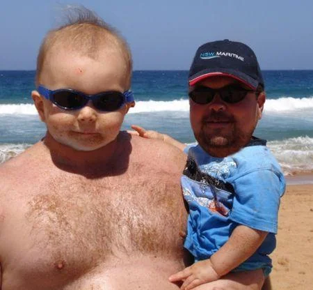 The full-resolution beach face-swap, one of the most widely shared examples of the manbabies meme.