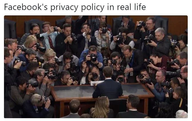 A meme referencing Facebook's photo tagging feature, using the iconic image of Zuckerberg mobbed by press photographers before his testimony.