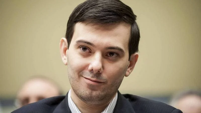 Martin Shkreli's now-iconic smirk during his 2016 congressional hearing appearance.
