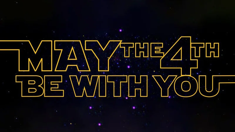The signature 'May the 4th Be With You' banner referencing the Star Wars pun celebrated annually on May 4th.