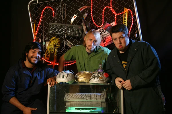 The Mega64 trio in a 2008 promotional photo, showcasing the group's signature blend of video game culture and comedy aesthetics.