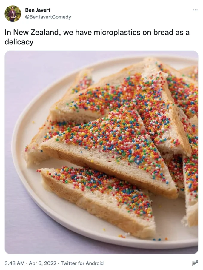 A tweet from @BenJavertComedy comparing Australasian fairy bread's rainbow sprinkles to a 'microplastics on bread' delicacy.