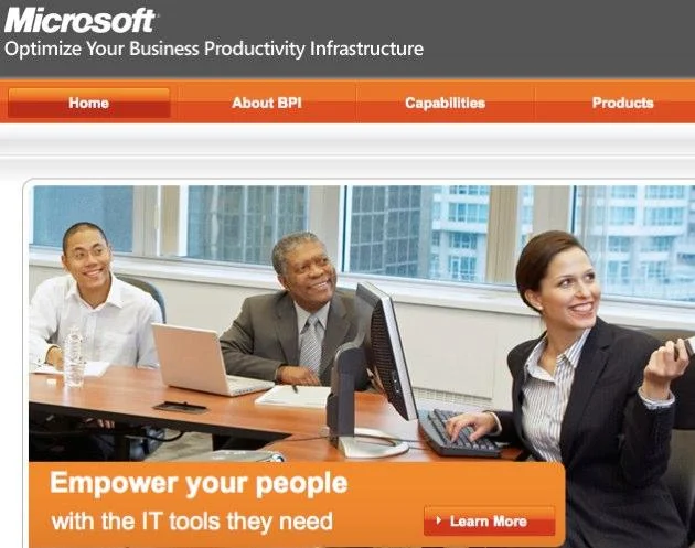 The original English-language Microsoft business ad featuring a multiracial group of coworkers.