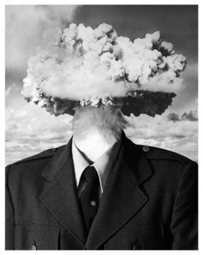 A surreal image of a man with a mushroom cloud for a head, a striking visual metaphor for 'mind blown'.