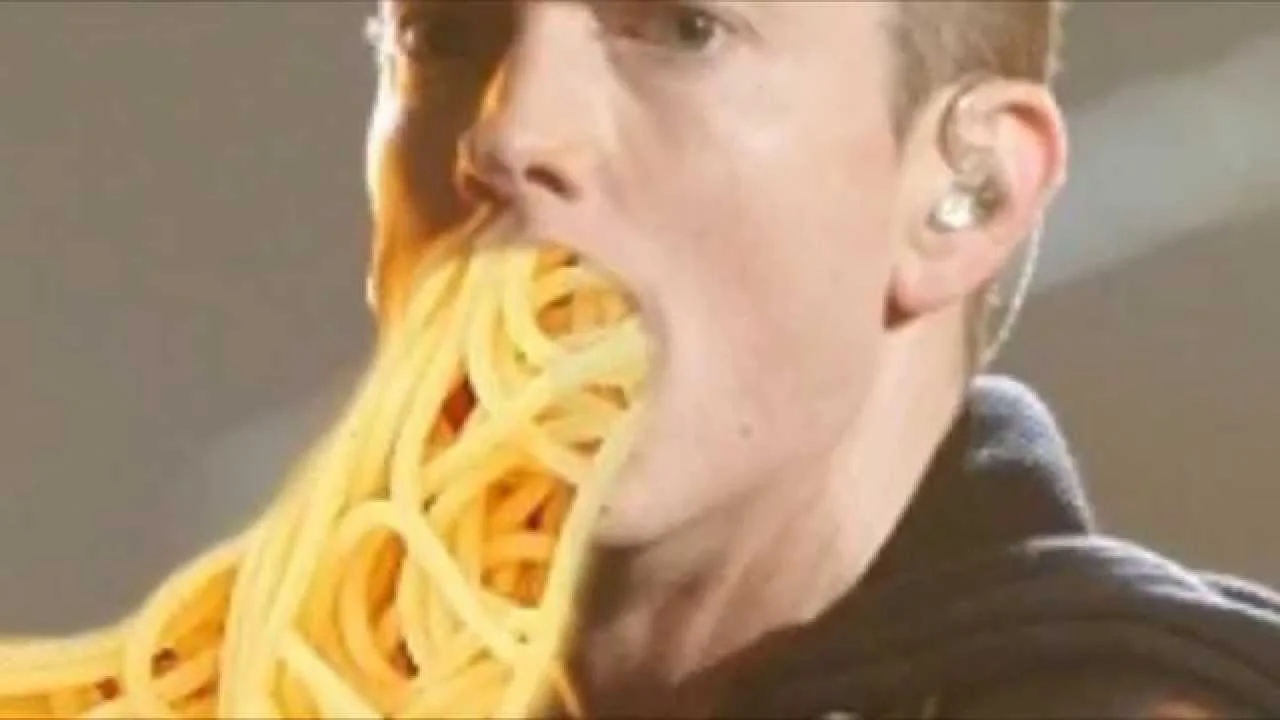 The iconic edited image of Eminem with spaghetti spilling from his mouth, referencing the famous lyric from 'Lose Yourself.'