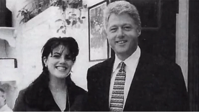 The iconic photograph of White House intern Monica Lewinsky with President Bill Clinton that became emblematic of the 1998 scandal.