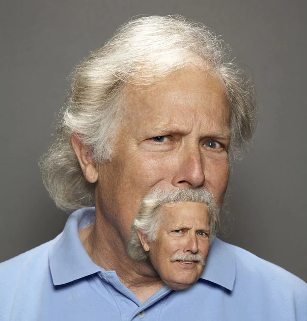 The archetypal 'moustair' image: a man whose moustache is replaced by a shrunken copy of his own head.
