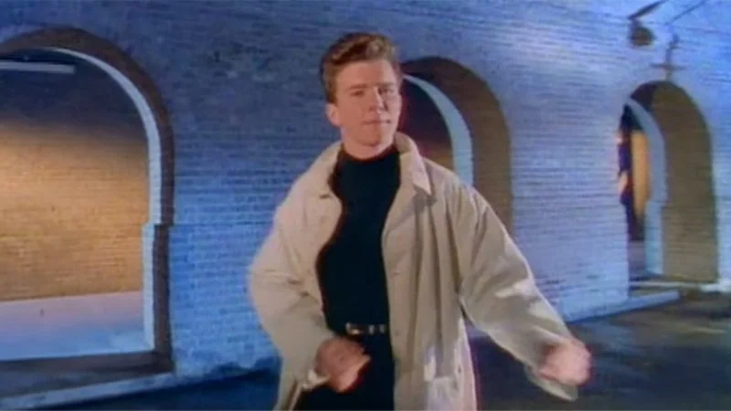 Rick Astley in his iconic rickroll outfit.