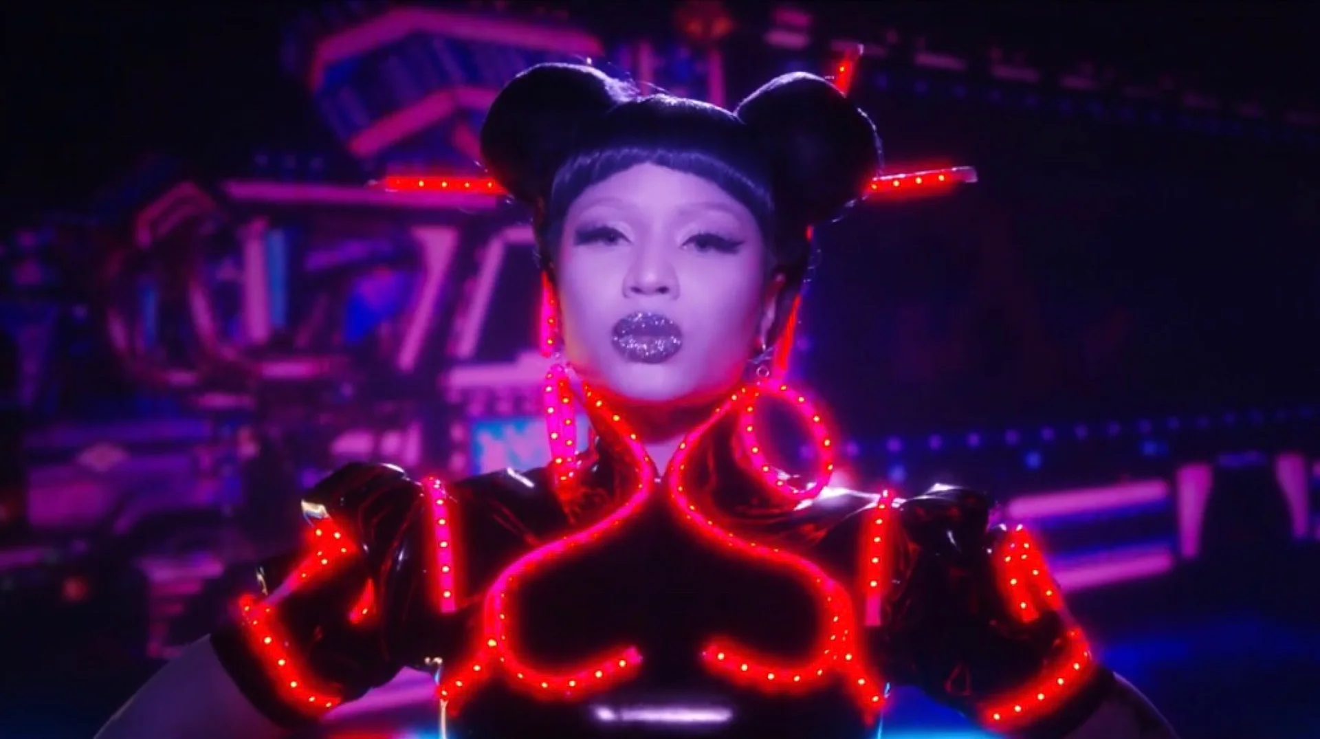 Nicki Minaj channels Street Fighter's Chun-Li with signature double buns and neon-lit styling in the official 'Chun-Li' music video (2018).