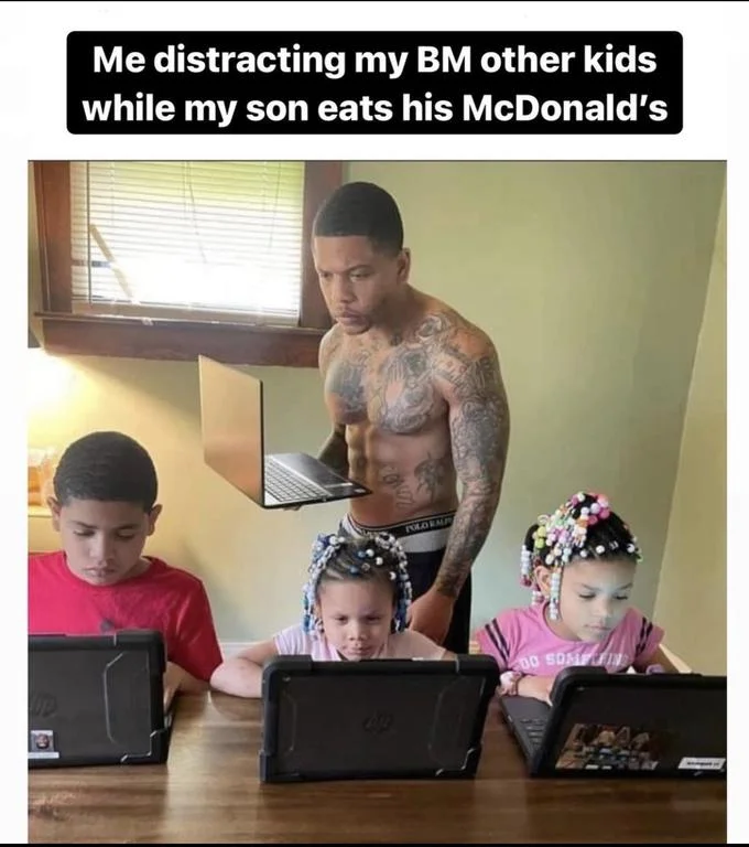 Father distracting other kids while son eats McDonald's.