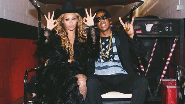 Two women making hand gestures photo.