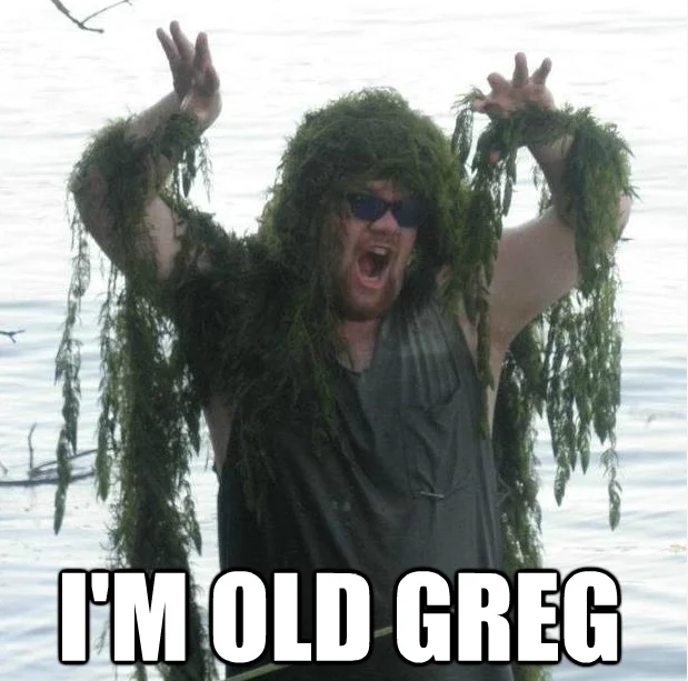 An 'I'm Old Greg' image macro made from a real-life photo of a man covered in lake weeds.