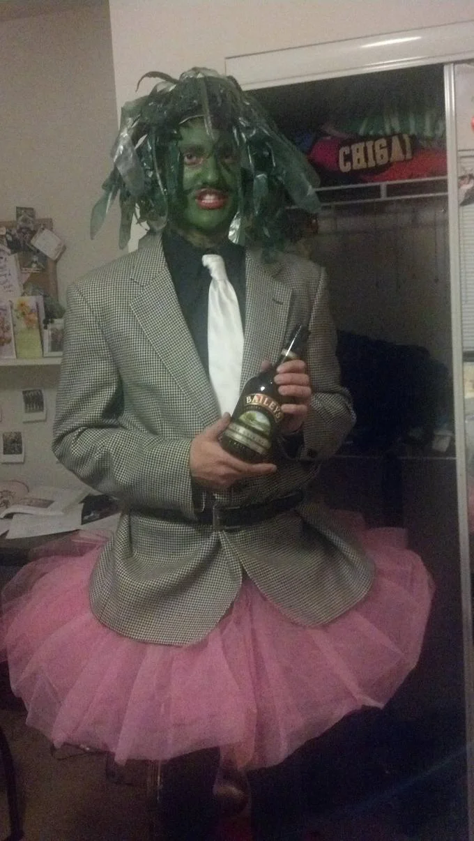 A fan cosplay of Old Gregg complete with the character's signature Bailey's bottle and pink tutu.