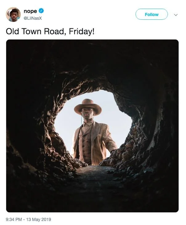 Old Town Road promotional image with cowboys.