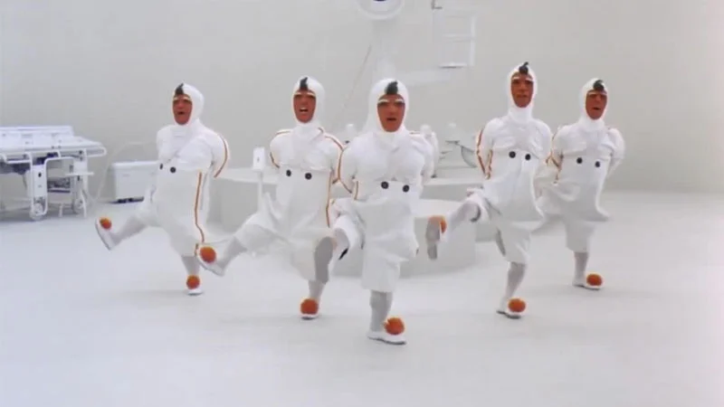 The original scene from Charlie and the Chocolate Factory (2005) featuring the Oompa Loompas performing their signature synchronized dance.