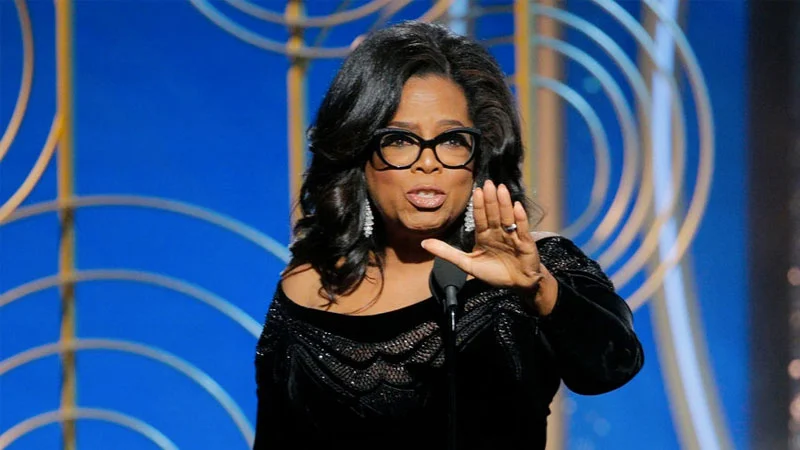 Oprah Winfrey delivering her viral Cecil B. DeMille Award acceptance speech at the 2018 Golden Globes, which sparked widespread speculation about a 2020 presidential run.