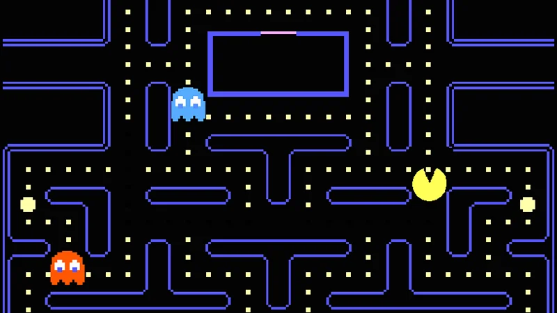 The iconic Pac-Man arcade gameplay, showing Pac-Man navigating the blue maze while pursued by ghosts.