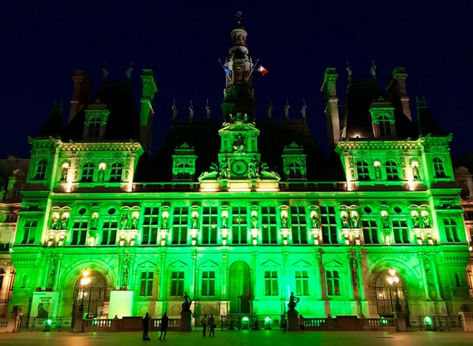 Paris City Hall was bathed in green light as Mayor Anne Hidalgo publicly rebuked the U.S. decision to leave the Paris climate accord.