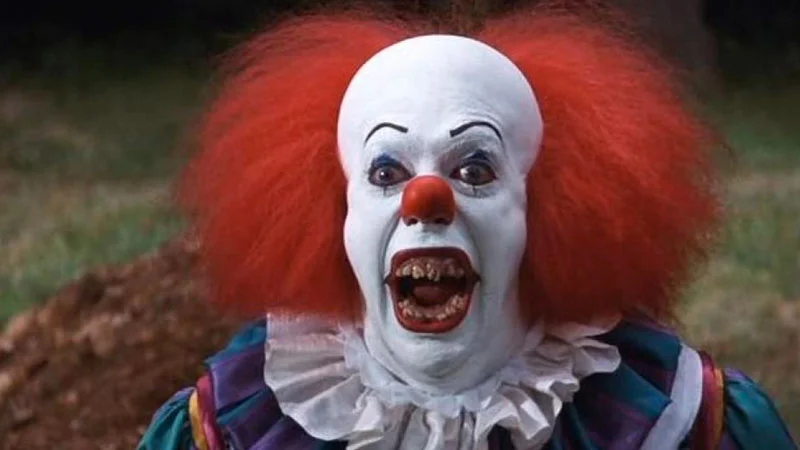 Tim Curry's iconic portrayal of Pennywise the Dancing Clown in the 1990 television adaptation of Stephen King's 'It'.