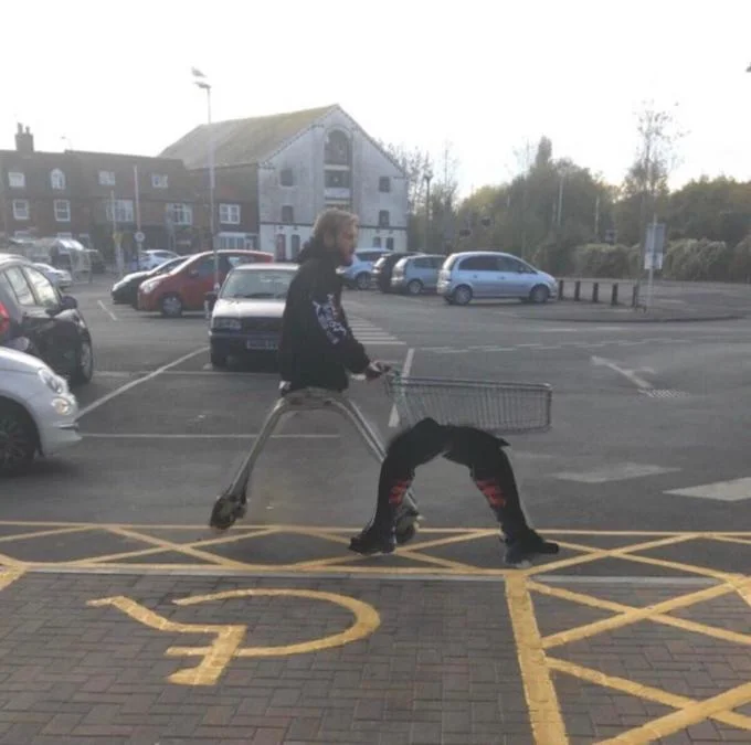 The original viral image of PewDiePie in a supermarket parking lot that sparked the 'PewDiePie has no legs' meme, with his legs appearing bizarrely bent or absent.
