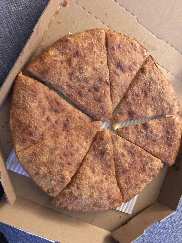 An unconventional pizza slicing crime.