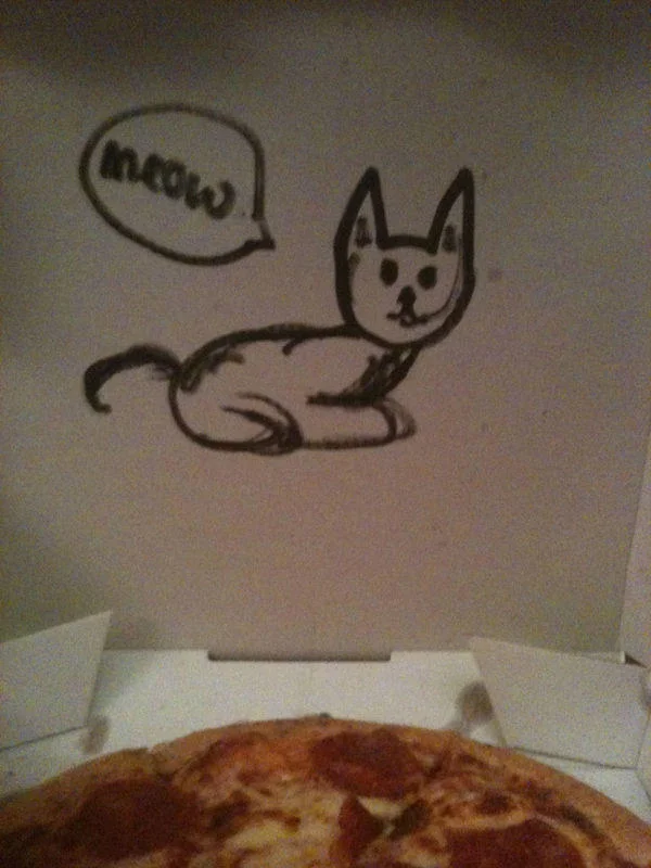 A pizzeria fulfilled a customer's request for a cat drawing on the box, a notable entry in the pizza-box art meme genre.