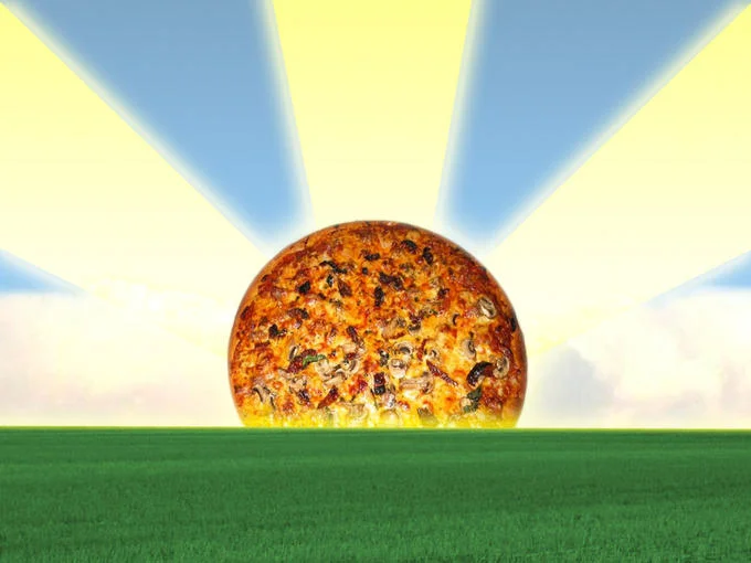 A surreal digital edit portraying a pizza as a rising sun, an example of pizza's transformation into absurdist internet art.