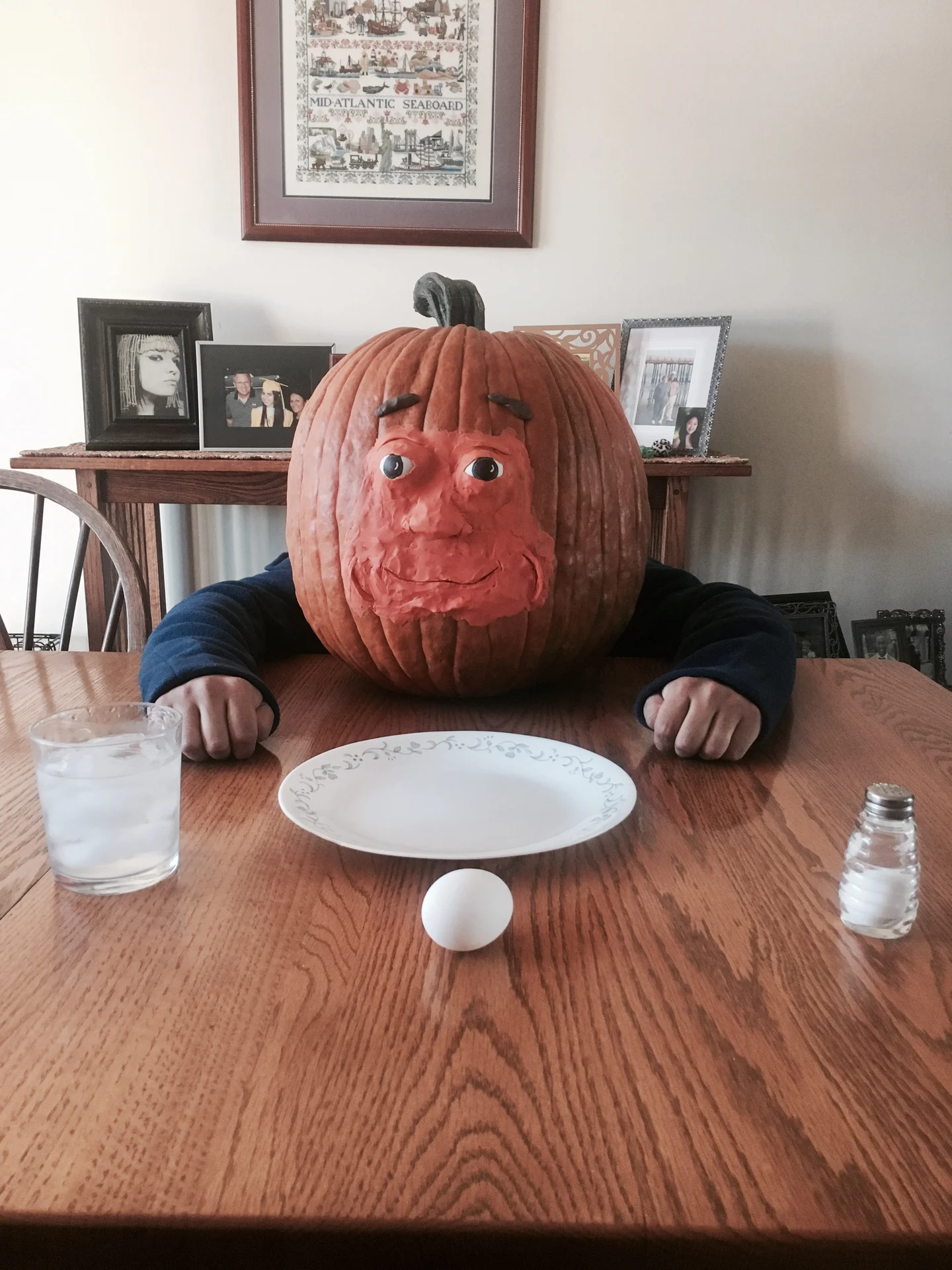 A fan-made real-world tribute to Pumkin, recreating the character with a carved pumpkin, clay features and the meme's classic empty-plate diner setup.