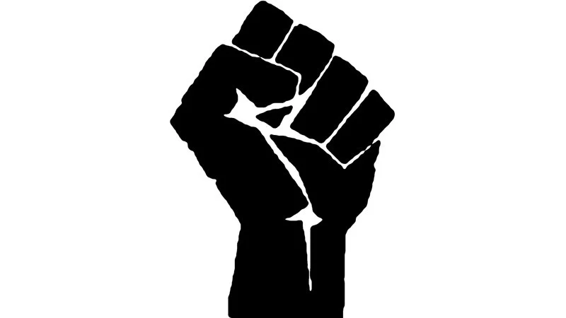 The canonical raised fist symbol widely used across empowerment and justice movements.