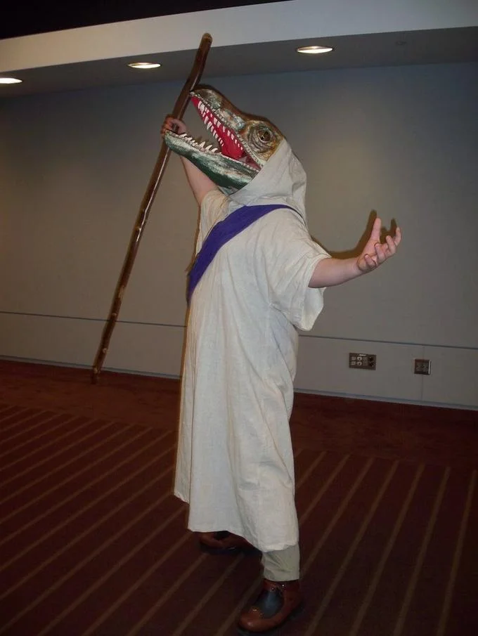 A fake 'Church of Raptor Jesus' marquee, nodding to the meme's 4chan origins and mock-religious devotion.