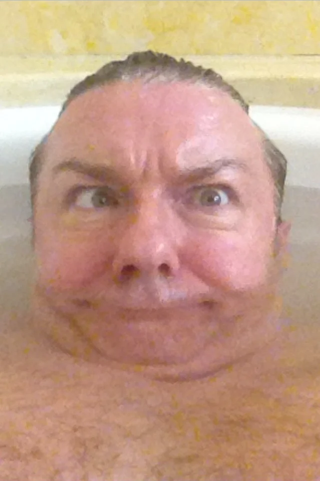 Ricky Gervais's viral bathtub selfie, in which he pulls a goofy cross-eyed expression that became widely shared as a reaction image.