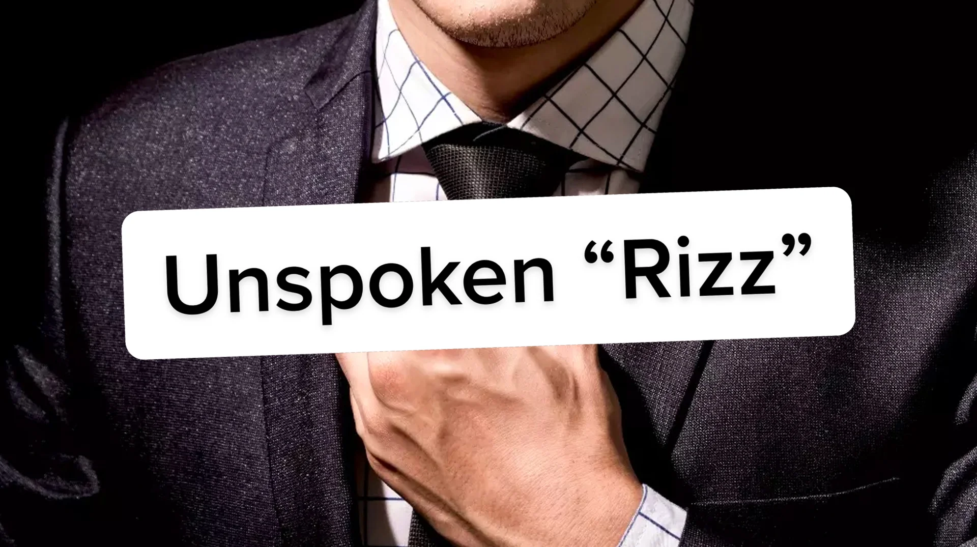 The 'Unspoken Rizz' title card featuring a suited man, commonly used as the header image for the meme.