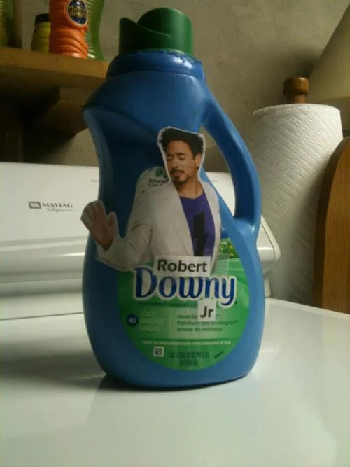 A physical pun replacing the Downy fabric softener mascot with Robert Downey Jr., a popular visual gag based on the actor's name.