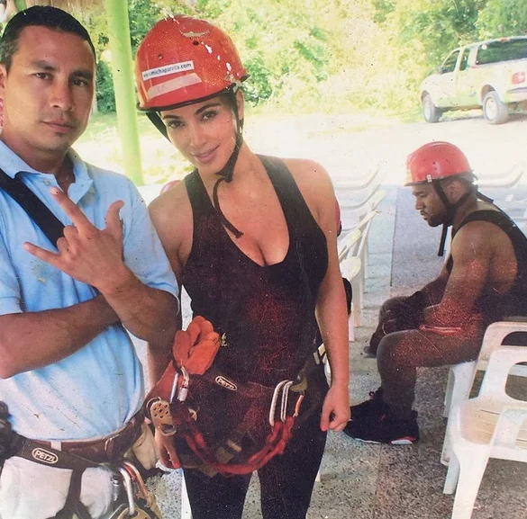 The original source photograph that spawned the 'Sad Kanye' meme, taken during Kim Kardashian and Kanye West's zipline trip in the Dominican Republic in May 2014.