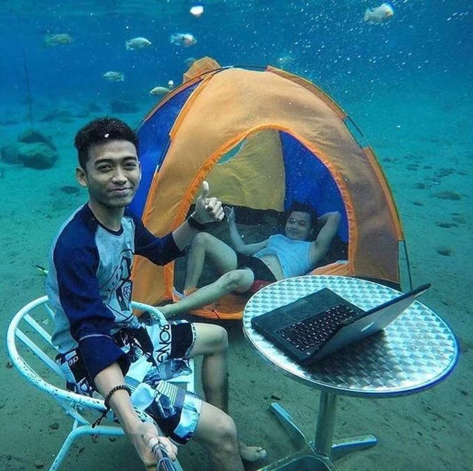Extreme Selfie Olympics underwater in tent.