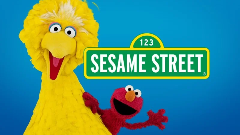 Official promotional show tile for Sesame Street featuring Big Bird, Elmo, and the series' signature street-sign logo.