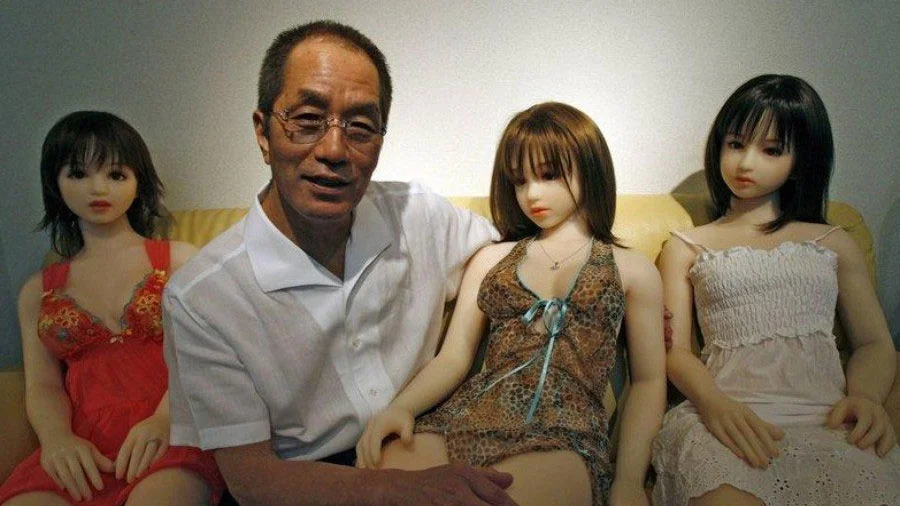 A widely circulated news photograph of a man posing with his collection of sex dolls, often used as the primary illustration for discussions about the sex doll subculture.