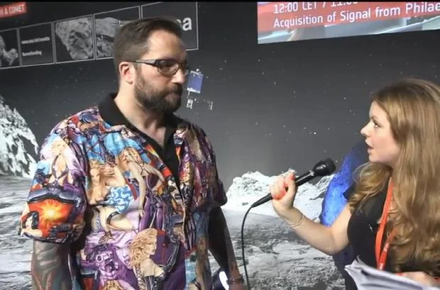 ESA project scientist Matt Taylor is interviewed during the November 2014 Rosetta comet landing while wearing the shirt that sparked the 'Shirtstorm' controversy.