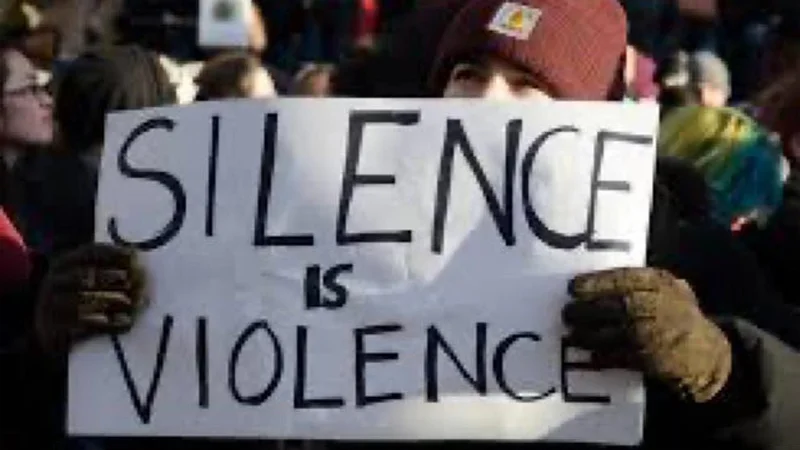 The source photograph of a protester's 'Silence is Violence' sign that became the visual foundation of the meme.