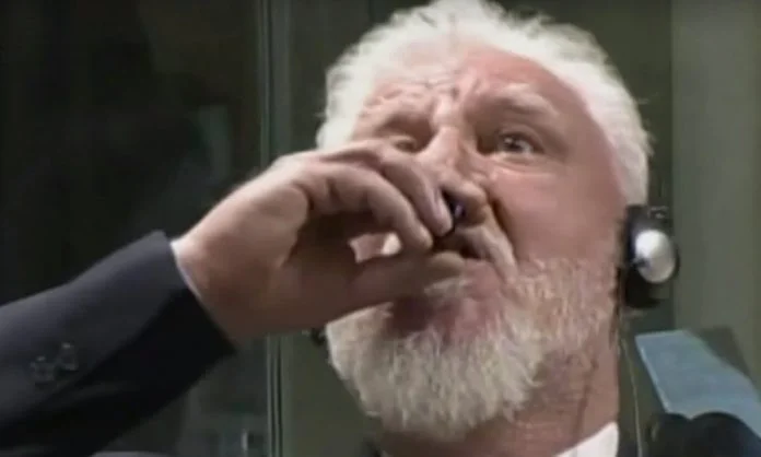The widely circulated news still of Slobodan Praljak drinking poison in The Hague during his 2017 war crimes verdict.