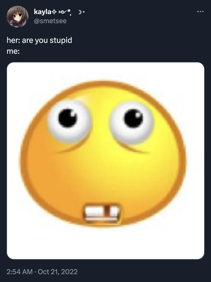 A tweet using a related buck-tooth emoji variant as a self-deprecating reaction to being called stupid.