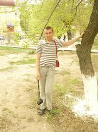 Sminem confidently poses in park.