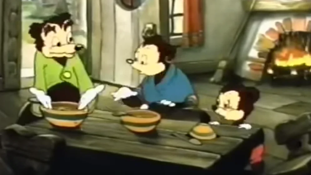 The original screenshot from the vintage Italian animated cartoon that spawned the 'Somebody Toucha My Spaghet' meme, showing the family at the dinner table before the infamous outburst.