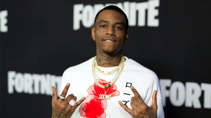 Rapper Soulja Boy at a Fortnite-branded red carpet event, a widely circulated press photo of the artist behind the meme.