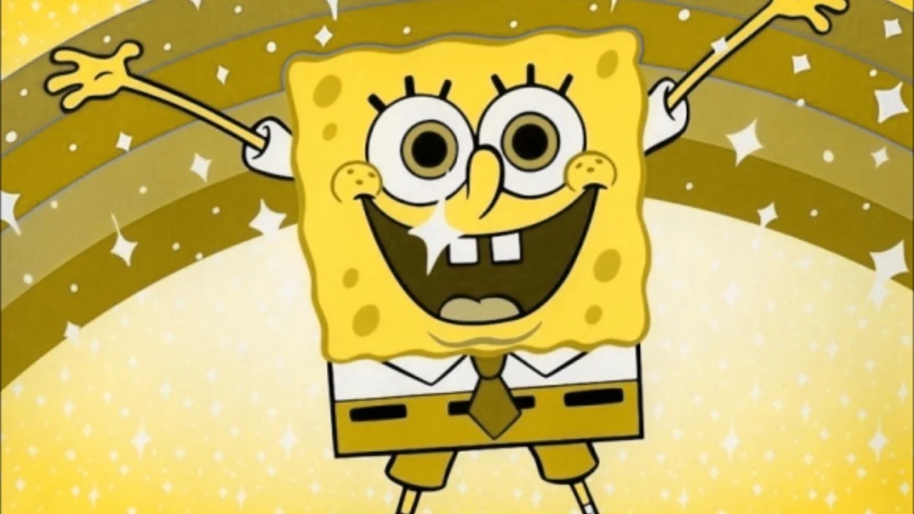 The iconic screencap of SpongeBob SquarePants celebrating with arms raised beneath a rainbow, taken from the episode 'The Best Day Ever'.
