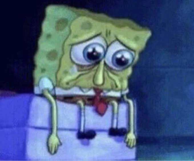 SpongeBob mid-performance with microphone.