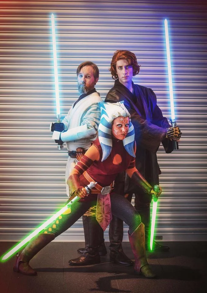 Fan cosplay group depicting the central Jedi trio of Star Wars: The Clone Wars — Obi-Wan Kenobi, Anakin Skywalker, and Ahsoka Tano.