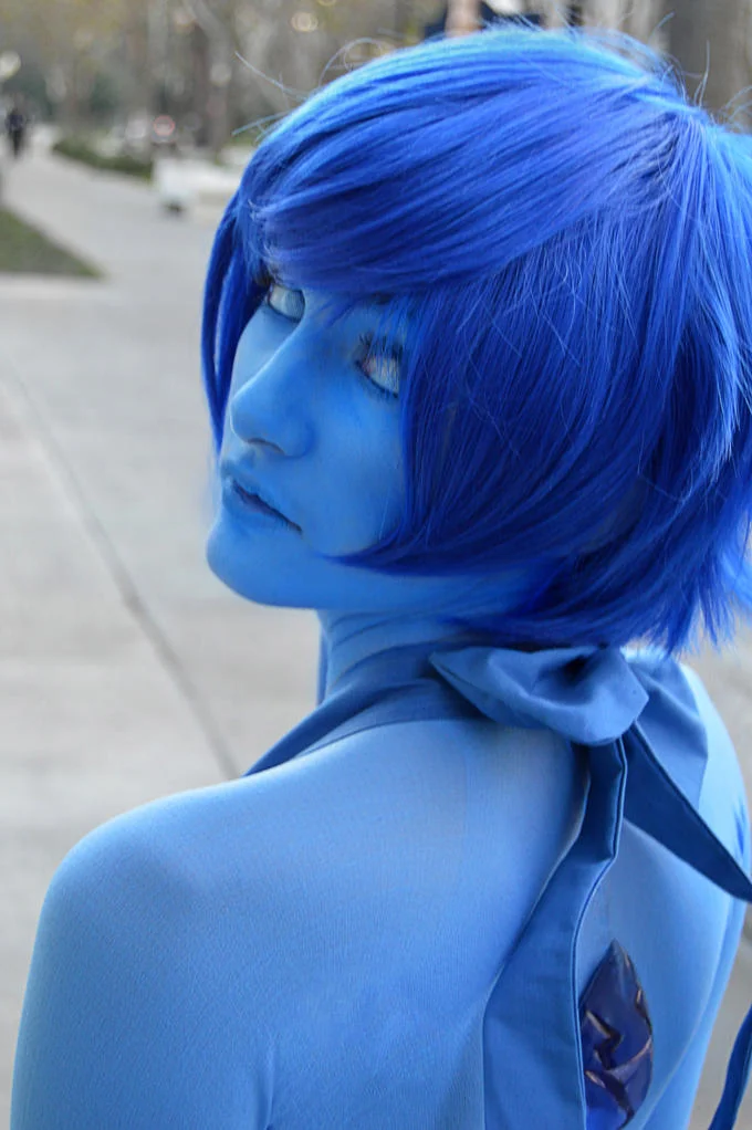 Cosplayer portraying Lapis Lazuli from Steven Universe at a convention.